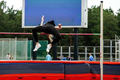 Female athlete jumper high jump in athletics