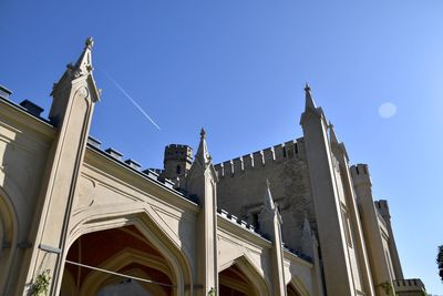 Low angle view of building against clear blue sky