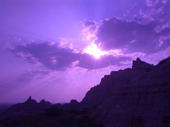 Low angle view of silhouette mountains against sky during sunset