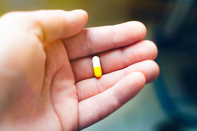 Close-up of person holding hand