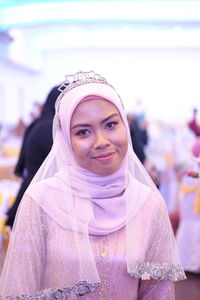 Portrait of bride in traditional clothing during wedding ceremony