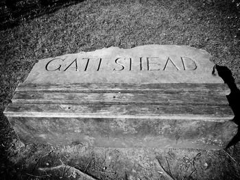 High angle view of text on bench at park