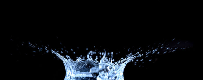 Close-up of splashing water against black background