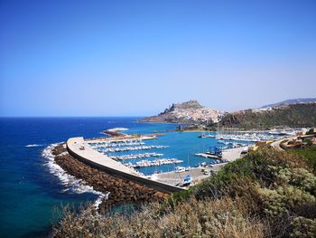 Scenic view of sea against clear blue sky