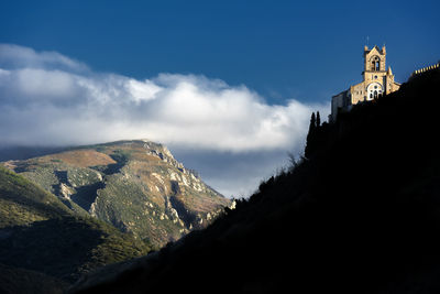 Low angle view of church un the mountain against sky