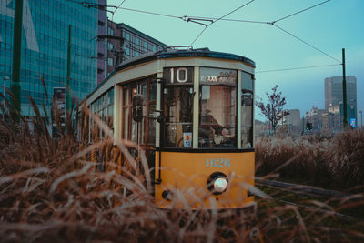 Train on railroad track against sky