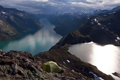 Scenic view of lake and mountains against sky