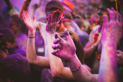 Group of people dancing on street during holi