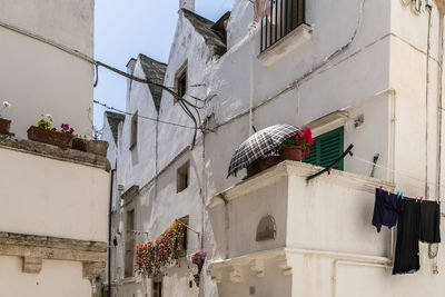 Low angle view of clothes drying on building