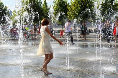 People enjoying in fountain
