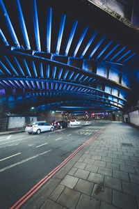 Cars on road in parking lot