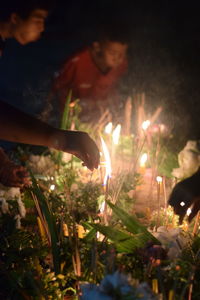 Lit candles in temple at night