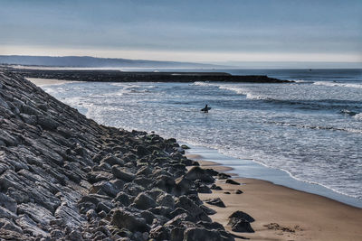Scenic view of beach against sky