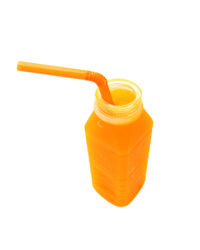 Close-up of yellow drink against white background