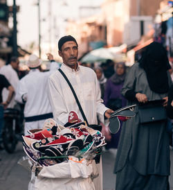 People standing on street in city