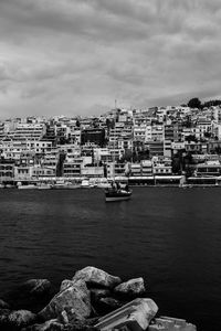 Scenic view of sea and buildings against sky