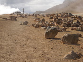 Scenic view of rocks on land against sky