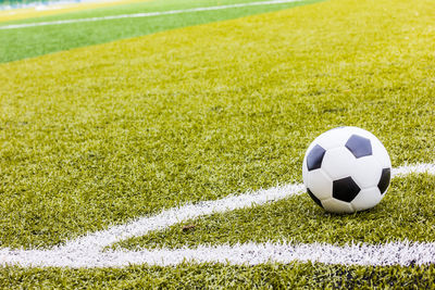 Close-up of soccer ball on field