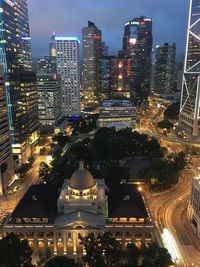 High angle view of illuminated cityscape against sky at dusk