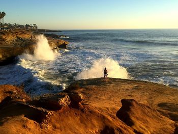 Scenic view of sea against clear sky during sunset