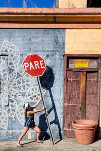 Low angle view of man standing in front of building