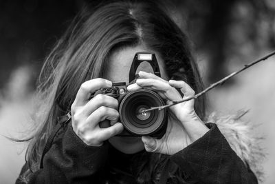 Close-up of hand holding camera