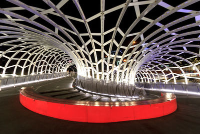 Illuminated ferris wheel at night