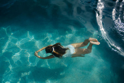 Girl swimming in sea