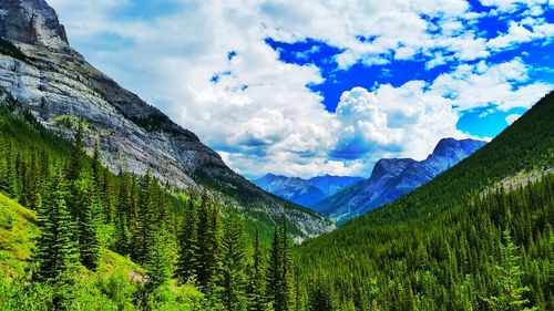 Scenic view of mountains against cloudy sky