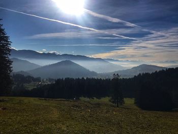 Scenic view of landscape and mountains against sky