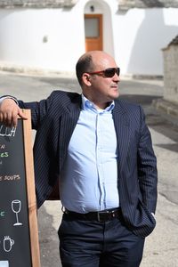 Man wearing sunglasses standing outdoors