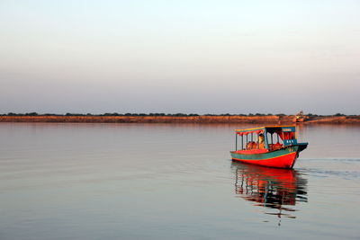 Boats in calm lake