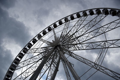 Low angle view of ferris wheel against sky