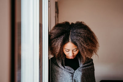 Portrait of young woman looking down