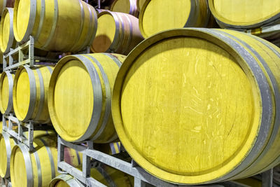 Metal silos for the fermentation of wine inside a farm. storage of wine in the cellar.