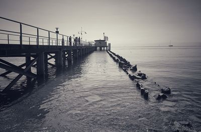 Pier over sea against sky