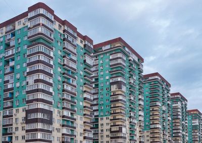 Low angle view of apartment building against sky