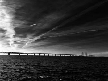 Bridge over sea against sky