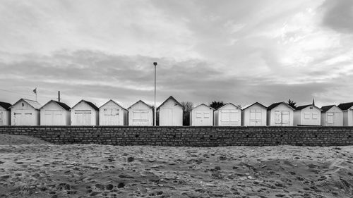 Houses on the beach in black and white