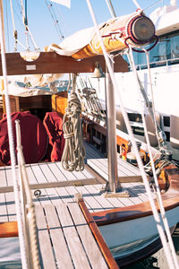 Sailboats moored in water