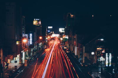 High angle view of light trails on city street at night