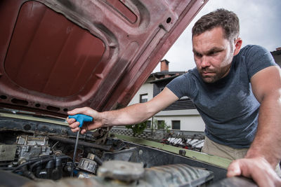 Man repairing car