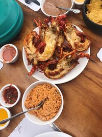 High angle view of food served in bowls and plate on table