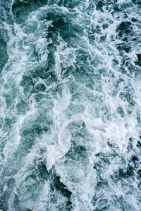 High angle view of water flowing over sea