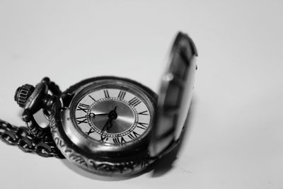 Close-up of clock against white background