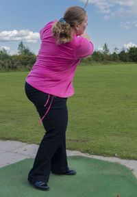 Full length of woman standing on field