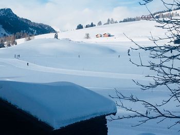 Scenic view of snow covered mountains against sky