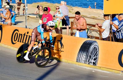Group of people riding bicycle