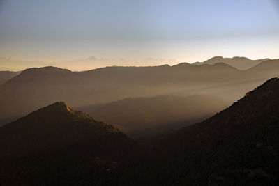 Scenic view of mountains against sky during sunset