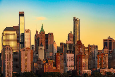 Modern buildings in city against sky